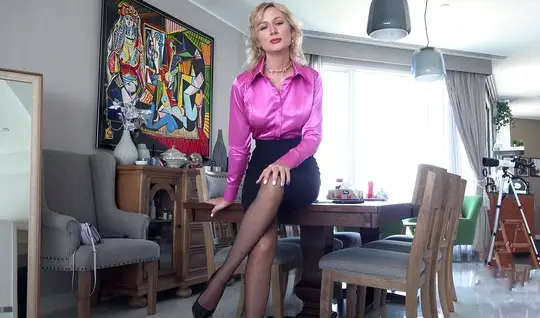 The blonde gently jerks off the guys cock between the lush boobs